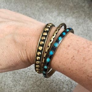 Stacked gold bracelets